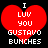 Red heart-shaped icon with white pixelated text reading "I LUV YOU GUSTAVO BUNCHES" on black background.