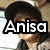 A four- of a person with long dark hair wearing a light-colored patterned top, with overlaid text reading "Anisa is da best"