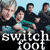 Pixelated static image of four people in a group pose with text "switchfoot" at the bottom, likely representing a band or musical act.