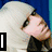 Pixelated image of a person with light hair and dark clothing, featuring text overlays in black boxes.