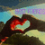 Animated sequence showing hands forming a heart shape against mountainous landscape with text above.