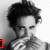 Black-and-white collage of four distinct headshots of a person with curly hair, featuring red text overlays reading "love," "robert," and "pattinson" across the bottom and right