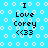 Pixelated blue background with white circles and a wavy line, displaying "I Love Corey <33" text in black. The text and background elements shift position across frames.