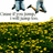 Two figures in blue jeans stand on a grassy field with yellow flowers, one figure holding a brown object while the other stands still.