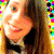 Pixelated close-up of a person with long brown hair wearing a black bow tie and dark clothing against a bright yellow background.