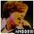 A pixelated image of a person with light brown curly hair wearing a white shirt, with the name ANDREW displayed in black text at the bottom.