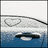 Pixelated static image shows a white vehicle with dark windows on blue water, under light gray sky with faint pixel clusters.