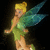 Pixelated figure with blonde hair in a bun, wearing green dress and blue wings against dark background.