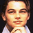 Pixelated image of a person with brown hair and light skin resting their chin on hands, next to purple background with blue text.