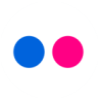 Two solid-colored circles, one blue and one pink, positioned side-by-side within a white circular frame against a gray background.