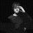 Pixelated grayscale icon of a figure with raised arm holding an object against dark background, rendered in low-resolution 256x256 pixels.