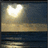 A static pixelated image shows a bright sun or moon over water with a gradient sky transitioning from dark blue to light yellow.