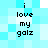 Pixelated text on a light blue background with two identical vertical of black lowercase letters reading "i love my galz"