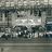 Pixelated grayscale image with indistinct shapes and light/dark patches, no clear subjects or text visible.