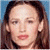 A pixelated image of a person with long brown hair against a light blue background, next to green text on dark green.