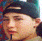 A pixelated image of a person wearing a dark cap with a light stripe, showing subtle facial expression changes across four