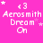 Pink background with white text reading 'Aerosmith Dream On' and small star symbols in various positions