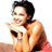 Pixelated static image of a person with dark hair wearing a bikini top, holding an object near their face against a white background.