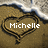 Pixelated heart-shaped icon with brown and black outline containing white text 'Michelle' on a textured background.