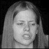 A black-and-white of nine showing a person's face transforming from unmade to fully made-up state with visible makeup application steps