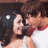 A static image shows a couple embracing on the left, with red background and white pixelated text on the right.