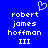 Blue background with white pixelated text reading 'robert james hoffman III' and a small heart symbol above the name on both sides.