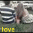 A pixelated image shows a person with long brown hair in a striped shirt, with yellow text reading 'love' at the bottom left.