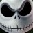Pixelated grayscale icon of a stylized skull with large black eye sockets, small nose holes, and stitched mouth.