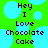 Green background with light blue circles and dark blue text reading 'Hey I Love Chocolate Cake' in pixelated font.