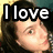 A pixelated image of a person with long dark hair, showing two where text above the head changes from "I love" to "You"