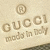 A static image of a Gucci logo with 'made in Italy' text on a light beige background, featuring a registered trademark symbol above the brand name.