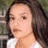 A pixelated image shows a person with long dark hair and light skin wearing a white top, next to text reading "OPPOSITE OF yes.".