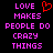 Pixelated text reads 'LOVE MAKES PEOPLE DO CRAZY THINGS' in pink with a red heart symbol above the word LOVE on black background.