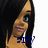 Pixelated close-up of a person with long dark hair, blue eyes, and light skin, wearing a white top with blue text.