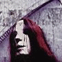 A pixelated image of a person with long dark hair and red highlights, wearing a hooded garment against a textured background.