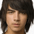 Static pixelated image of a person with dark shoulder-length hair, light skin, and neutral expression against a white background.