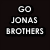 Black-and-white pixelated icon with text "GO JONAS BROTHERS" and "WOOOO!" above a shield-shaped emblem containing a stylized "B".