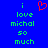 Blue background with green pixelated text reading "i love michal so much" and a red heart symbol above the first line.