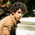 A pixelated image of a person with curly hair in two poses, overlaid with text reading "fuckin Selena stole my NICK" across three