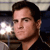 Static 50x50 pixel AIM buddy icon showing a close-up of a man's face with dark hair and neutral expression against blurred background elements.
