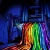 A pixelated static image with a dark blue background and a vertical rainbow gradient transitioning from red to purple.