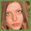 Four pixelated portrait arranged in a showing the same person with varying facial expressions and head positions