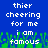 Blue background with white pixelated text reading 'thier cheering for me i am famous' over green pixelated grass-like shapes.