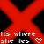 Red X-shaped pattern with black diamond center, pixelated text reading 'its where she lies' and 'broken inside', two heart symbols on red background.