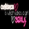 Black background with neon-style text reading 'confidence is what makes a girl sexy' and two heart symbols, one pink outlined and one white outlined.