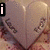 A heart-shaped object with text on its surface appears in four , each showing different overlaid text elements