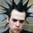 Pixelated image of a person with spiked hair and green text reading "GOOD CHARLOTE BENJI BEAST MADDEN ON GUITAR" on black background.