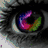 A static image of a human eye with multicolored iris, rainbow-colored butterfly wings, and hands forming heart shapes.