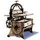 Static image of a vintage printing press with a wheel, drawer, and arched frame, set against a white background with blue shadow.
