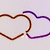 Two overlapping heart outlines in brown and purple on a light gray background, with yellow stars of varying sizes and colors on a bright yellow background.